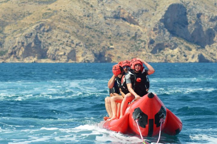 a group of people riding a banana boat